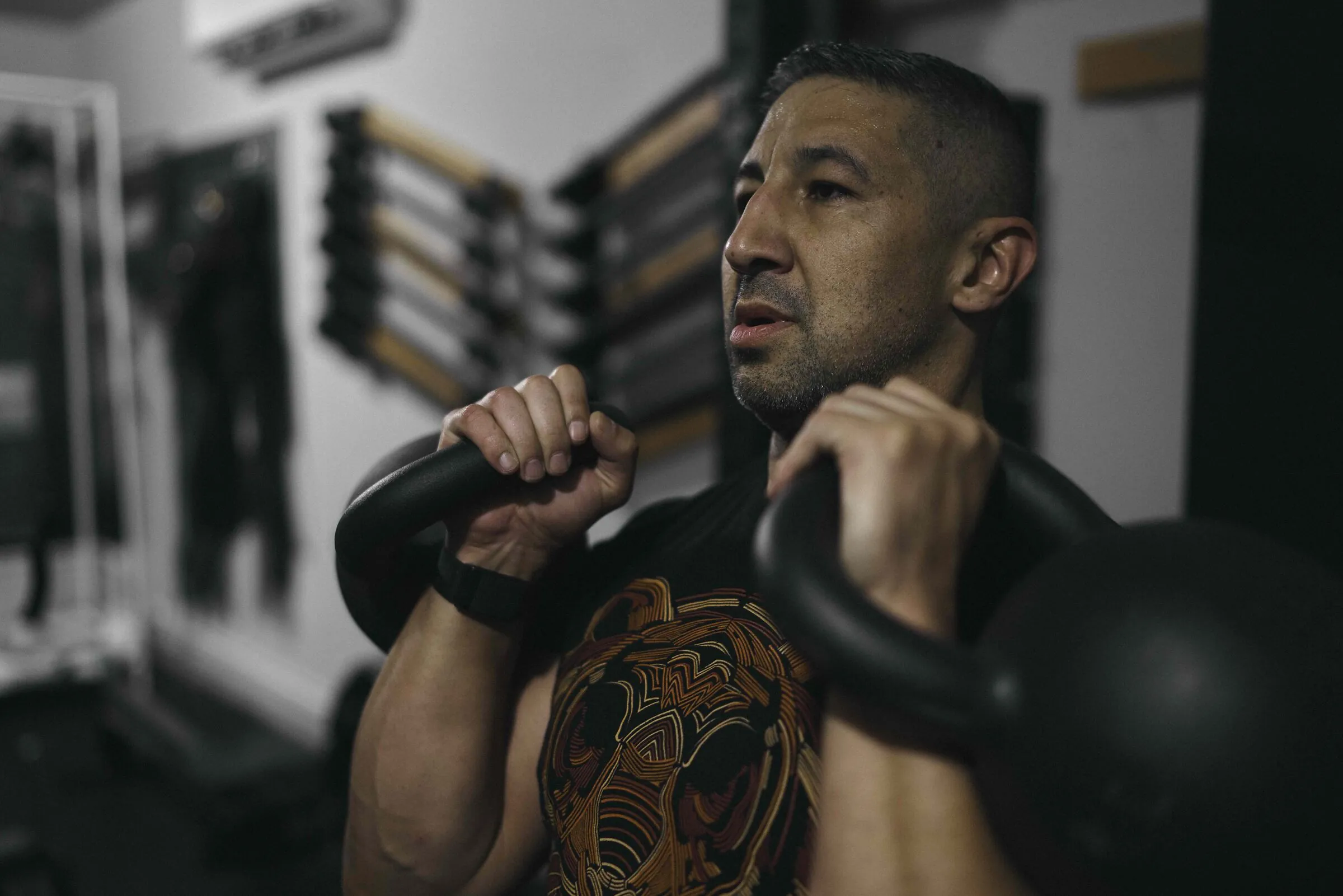 John Wolf with kettlebells at the Boerne training facility