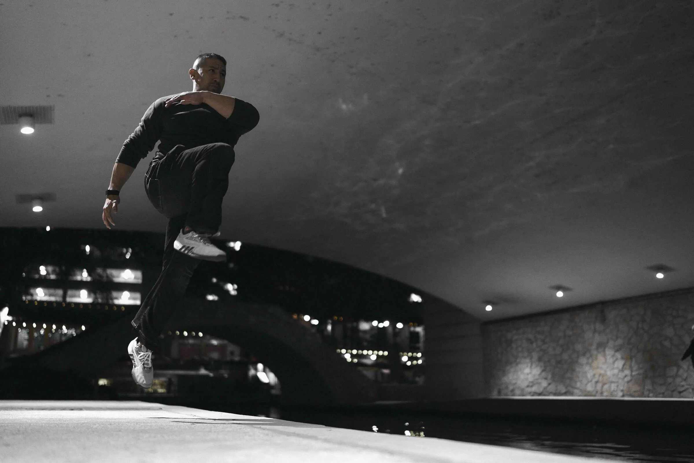 John Wolf in urban movement training under bridge